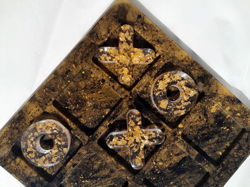 Handmade resin tic-tac-toe board in black and gold