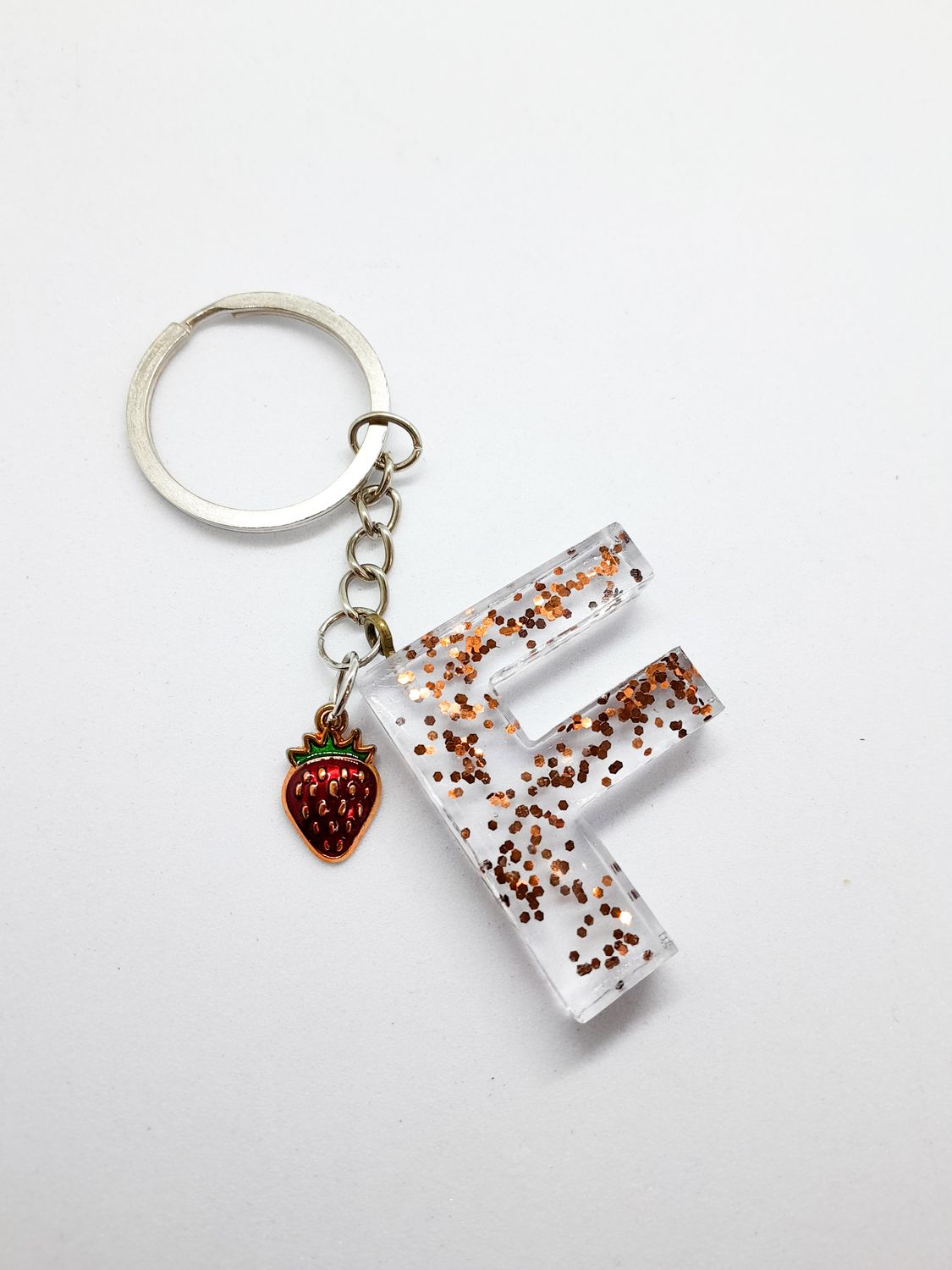 Resin initial keyholder letter F with gold flakes and strawberry detail 