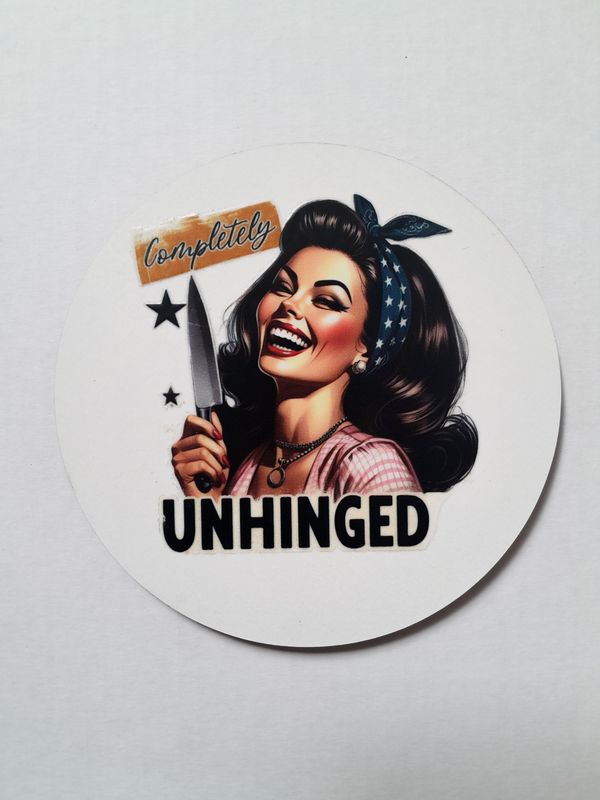 Printed coaster with smiling woman holding a knife, text reads “Completely Unhinged.”