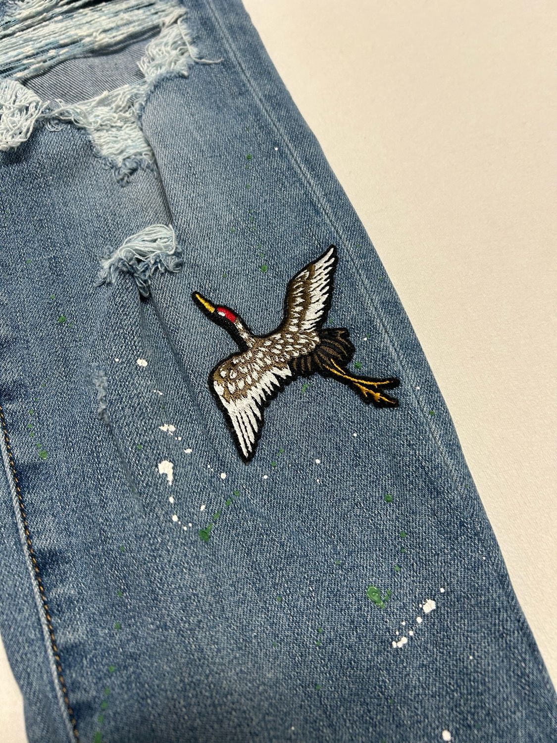 Amiri Crane Patch Paint Splatter Distressed Denim