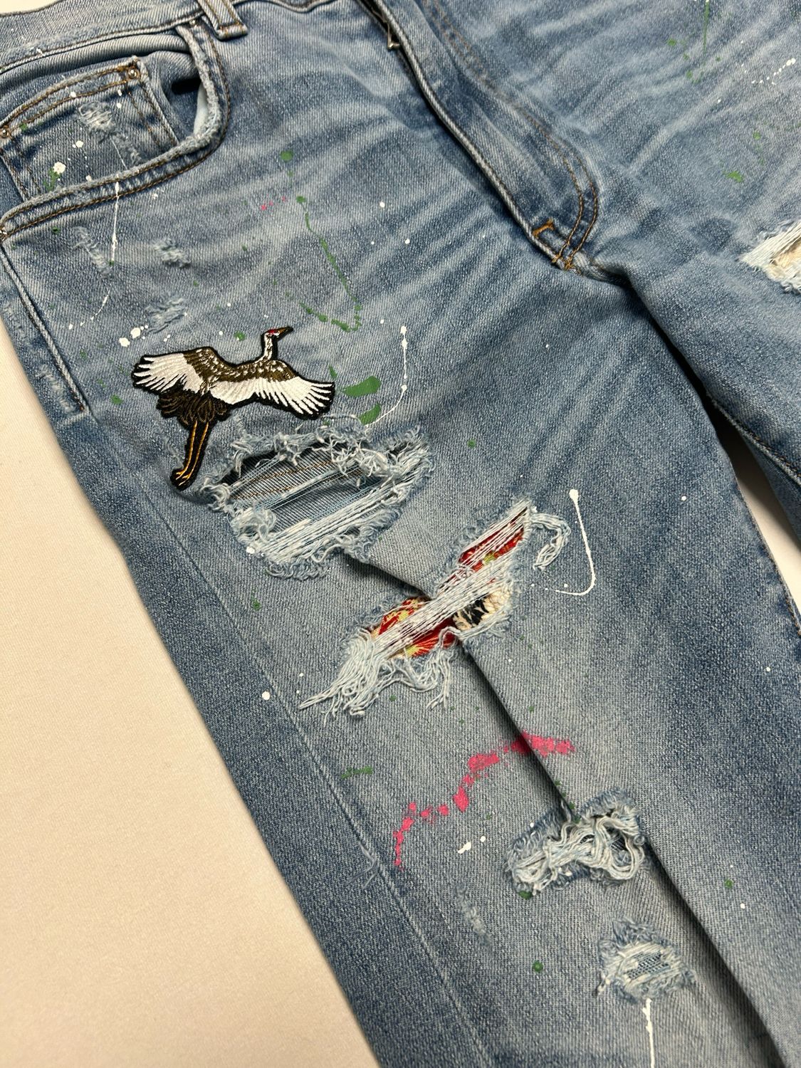 Amiri Crane Patch Paint Splatter Distressed Denim