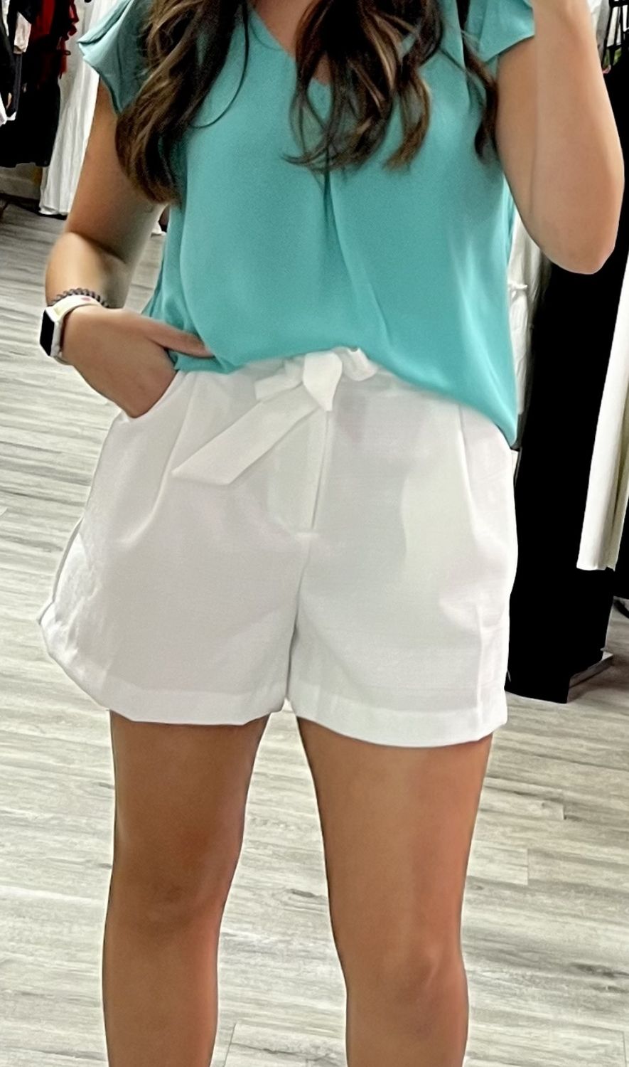 glam white dress shorts with bow belt