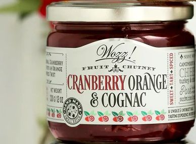 Jar of Wozz Kitchen Cranberry Orange & Cognac Spread with cranberries, orange zest, and brandy
