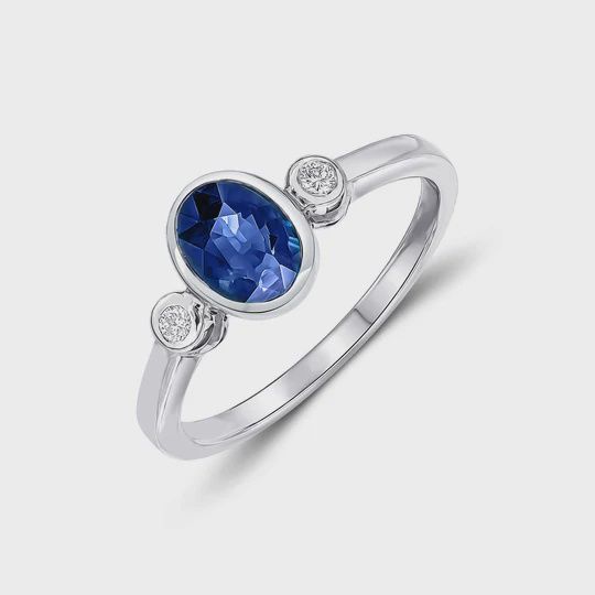 9ct 0.92ct Oval Sapphire &amp; 0.05ct Diamond Rubover Three Stone Ring