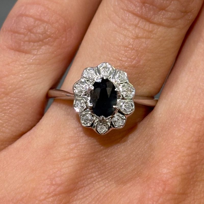 Pre-Owned 9ct White Gold 0.65ct Sapphire & 0.05ct Diamond Cluster Ring Pre-Owned 9ct White Gold 0.65ct Sapphire & 0.05ct Diamond Cluster Ring