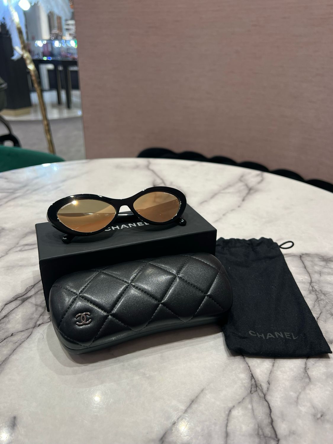 Pre-Owned Chanel Oval Sunglasses with Gold Mirror Lense