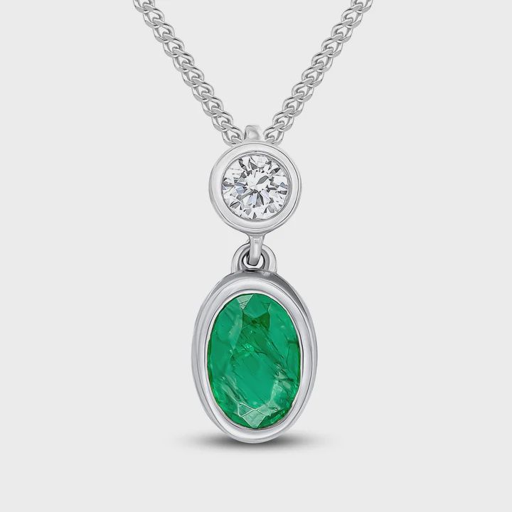 18ct White Gold Oval Emerald &amp; Round Diamond Two Stone Pendant