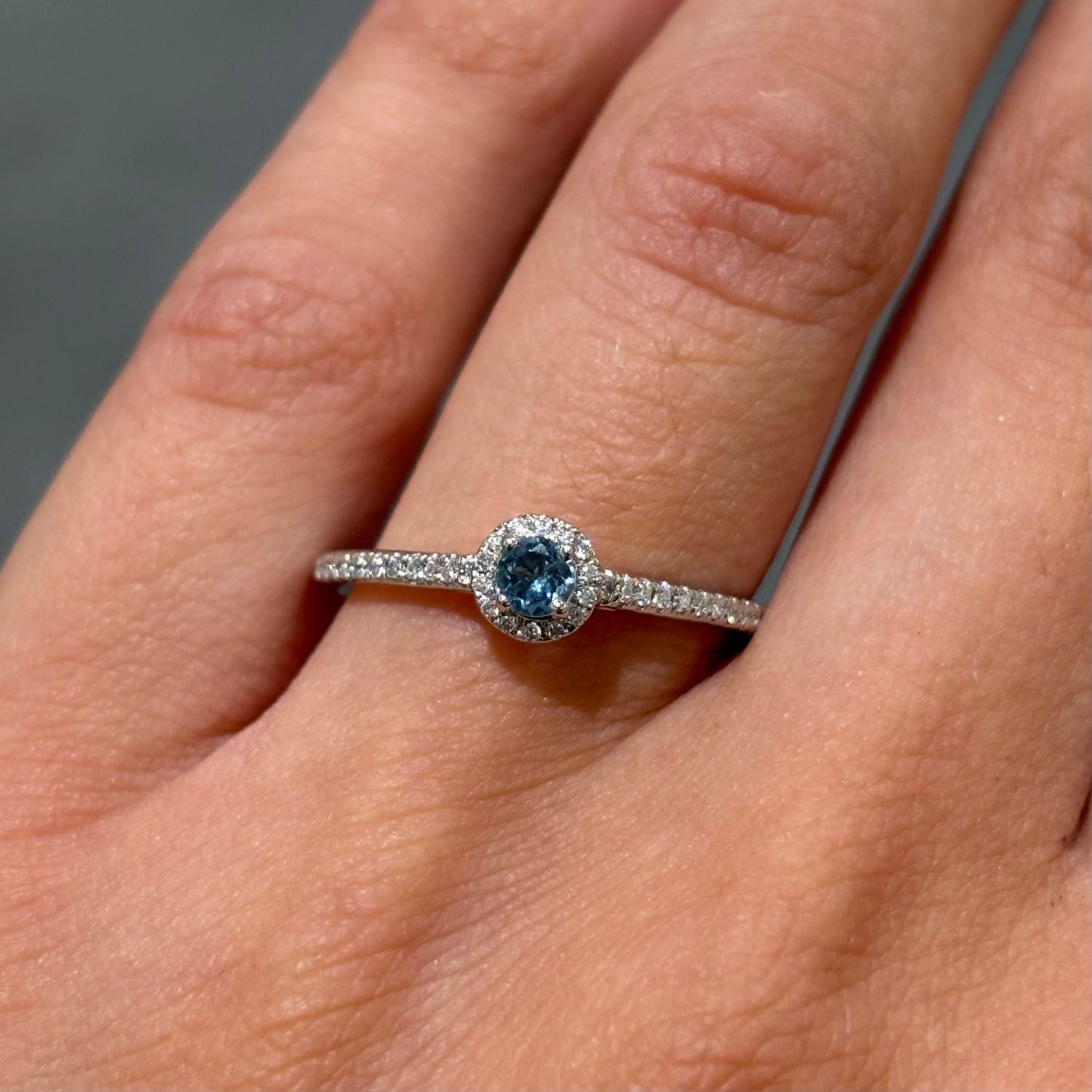 18ct White Gold Round Aquamarine & 0.11ct Diamond Halo Shoulders Ring 18ct White Gold Round Aquamarine & 0.11ct Diamond Halo Shoulders Ring