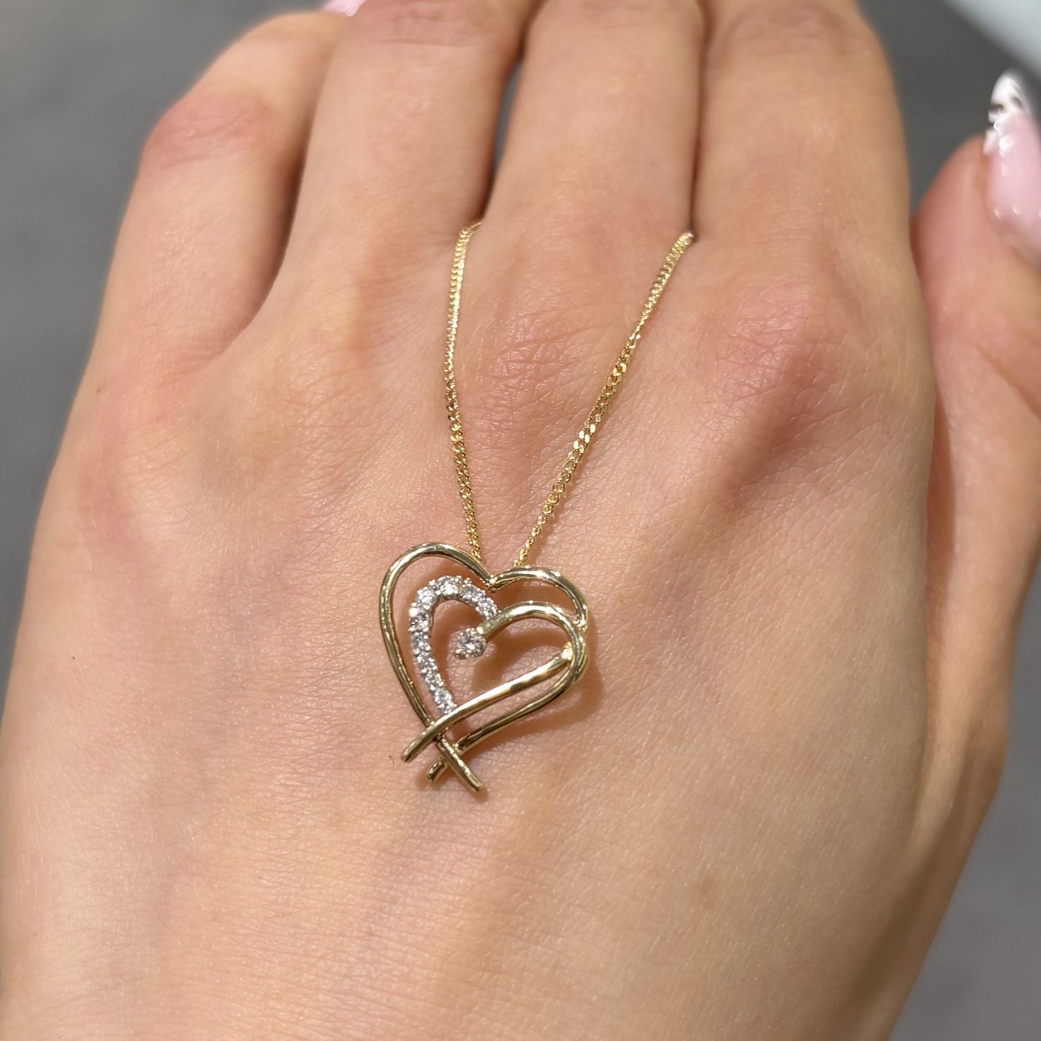 Pre-Owned 9ct Yellow Gold 0.10ct Diamond Double Heart Pendant