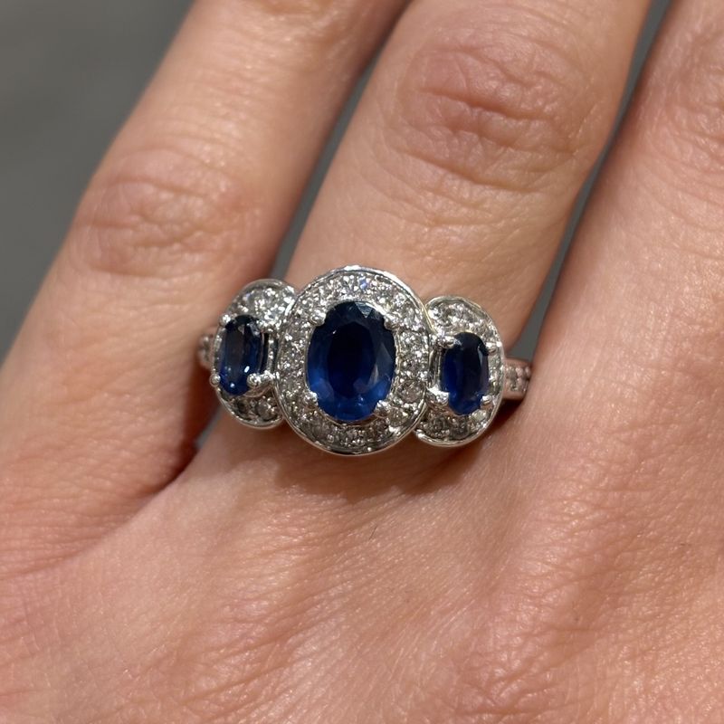 Pre-Owned 14ct White Gold 1.33ct Three Stone Sapphire 0.48ct Diamond Halo Style Ring Pre-Owned 14ct White Gold 1.33ct Three Stone Sapphire 0.48ct Diamond Halo Style Ring