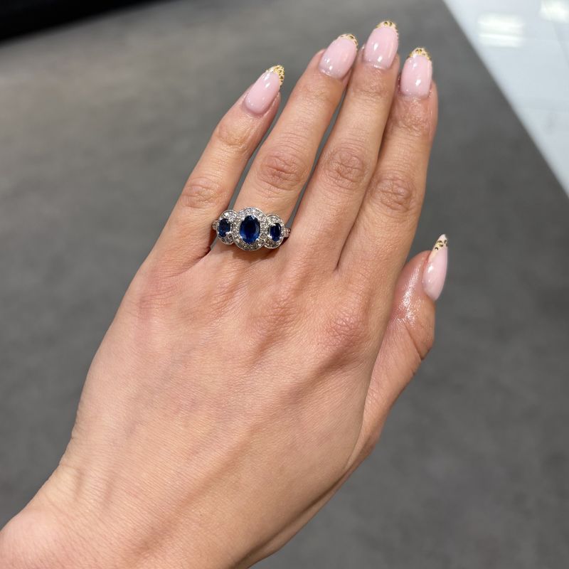 Pre-Owned 14ct White Gold 1.33ct Three Stone Sapphire 0.48ct Diamond Halo Style Ring