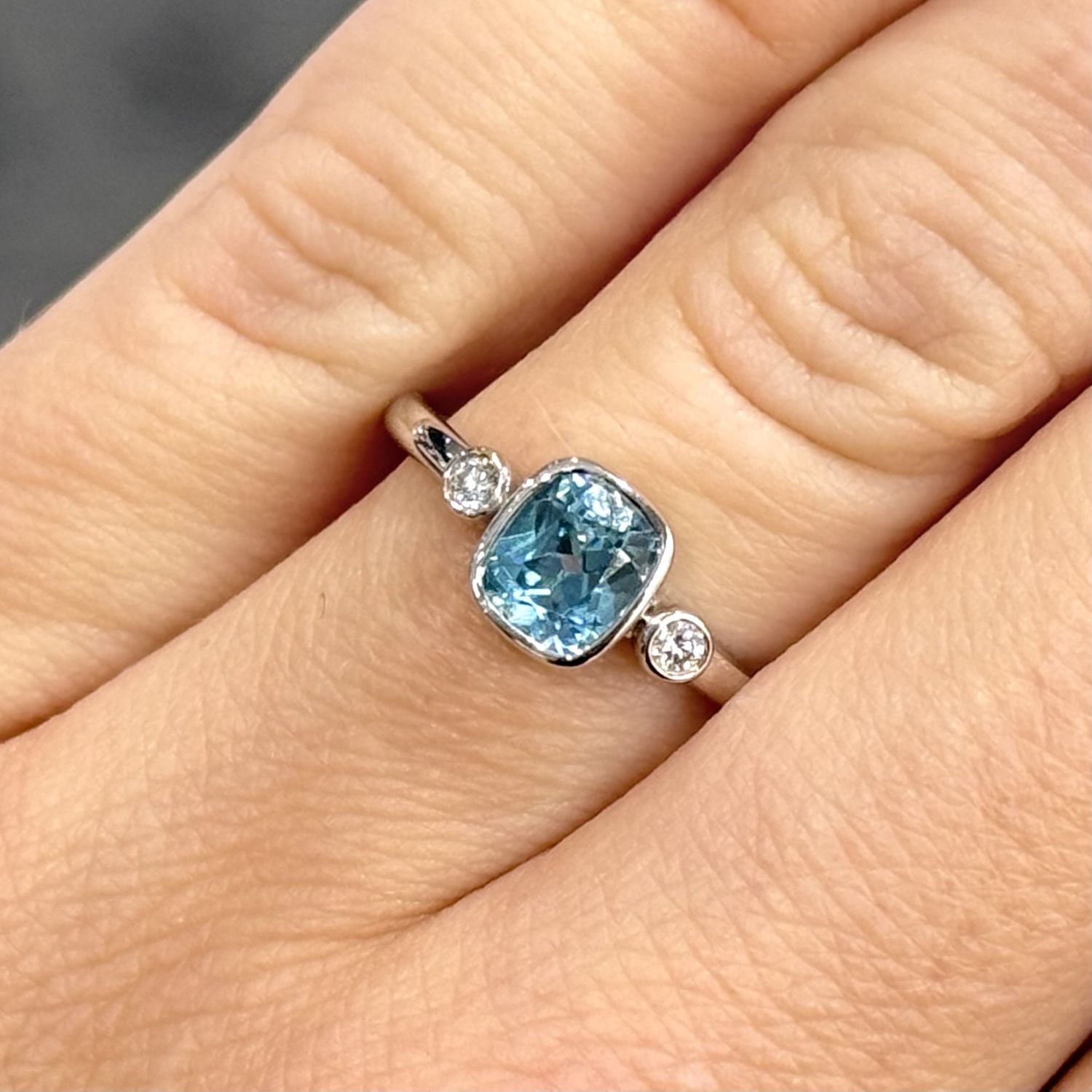 9ct White Gold 1.04ct Cushion Cut Blue Zircon & Diamond Trilogy Ring 9ct White Gold 1.04ct Cushion Cut Blue Zircon & Diamond Trilogy Ring