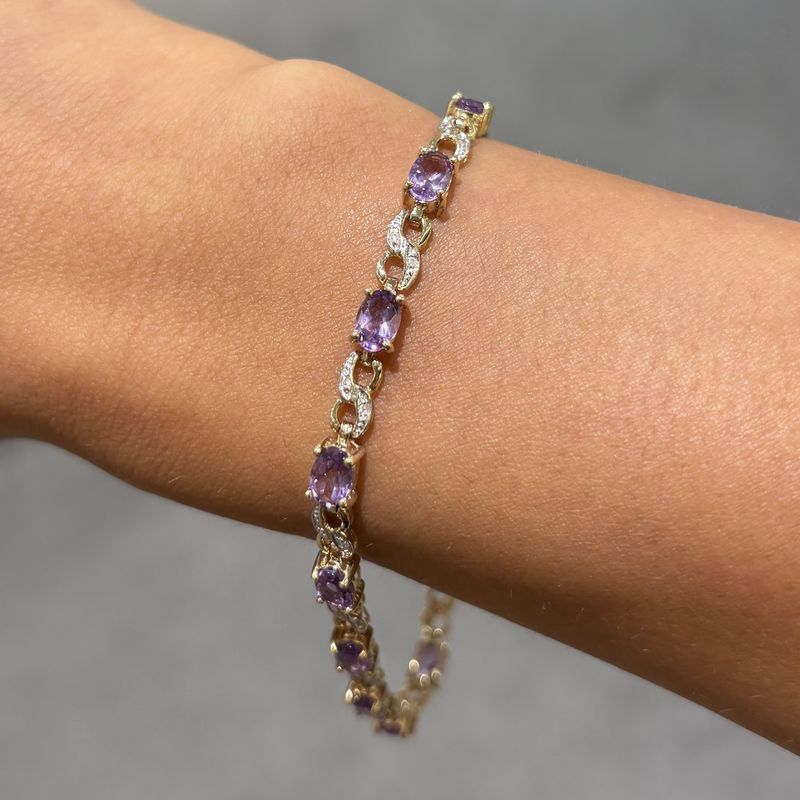 Pre-Owned 9ct Yellow Gold 4.20ct Oval Amethyst & 0.15ct Diamond Tennis Bracelet Pre-Owned 9ct Yellow Gold 4.20ct Oval Amethyst & 0.15ct Diamond Tennis Bracelet