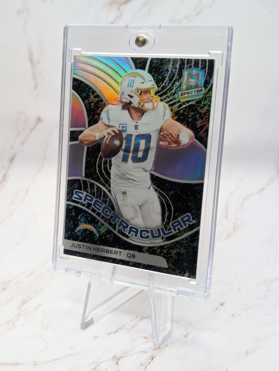 2022 Panini Spectra Spectracular Justin Herbert #SPEC-JHE Neon Splatter Prizm /8