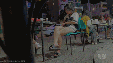 Crossed Soles On The Street Corner