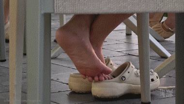 Crossed Soles At Adjacent Tables