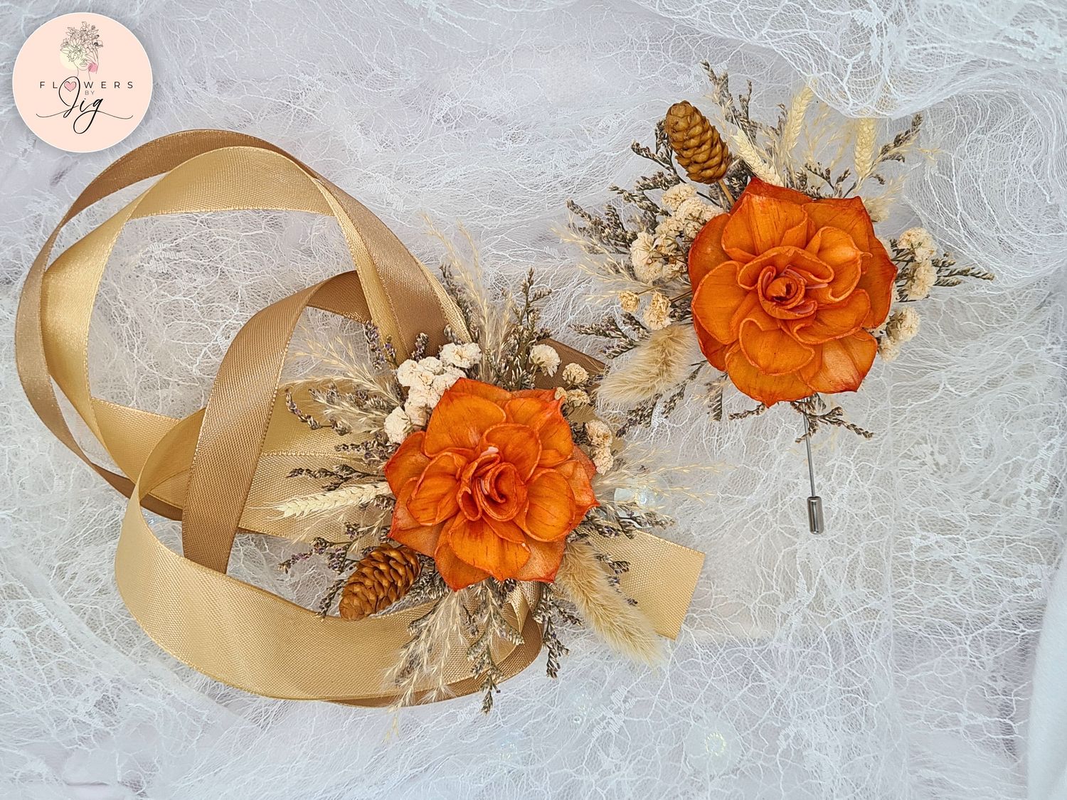 Handcrafted orange dahlia sola wood corsage and boutonniere set featuring dried flowers like gypsophila and caspia, gold satin ribbons. Eco-friendly, long-lasting floral accessories for weddings and proms.