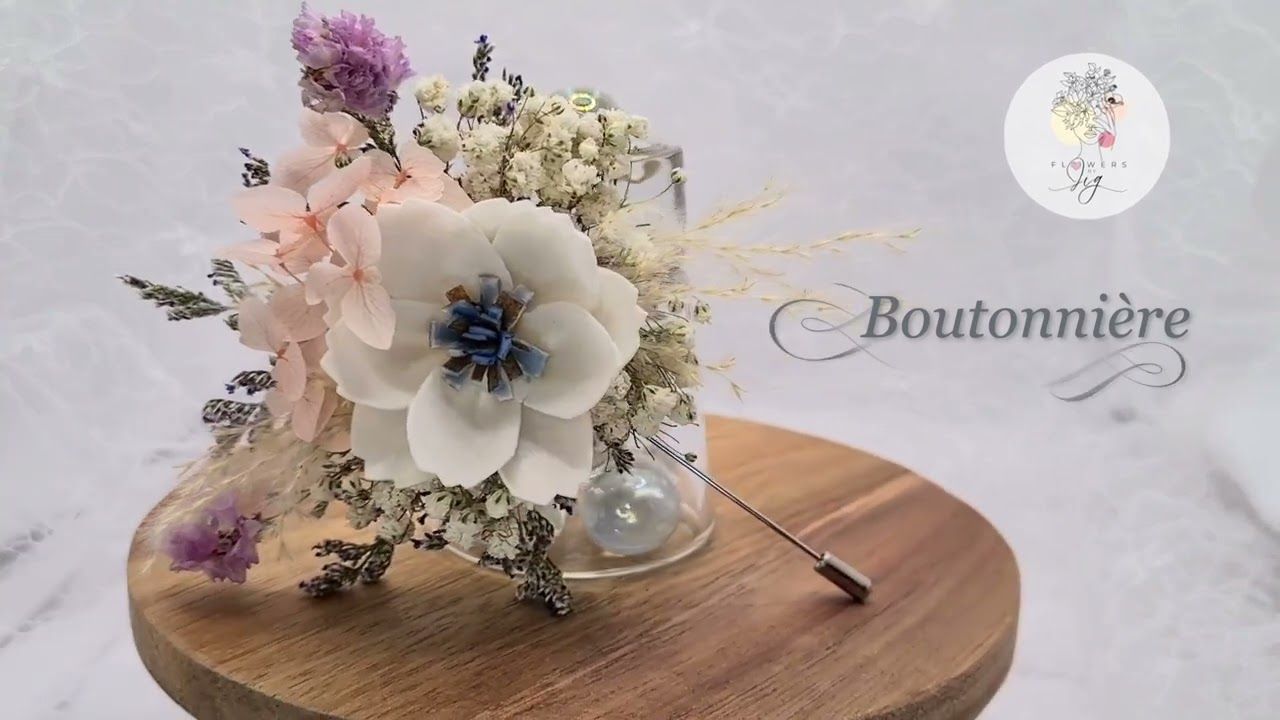 White Cosmos Corsage or Boutonnière w/ caspia, gypsophila, statics, hydrangea &amp; finished with white and pink ribbons. A lovely classic look.