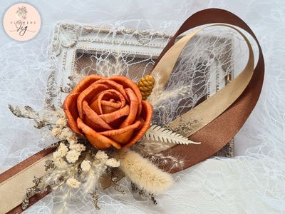 Elegant Sola Wood Corsage featuring an orange-brown rose, meadow foliage, and satin ribbon. Perfect for weddings and proms. Handcrafted, durable, eco-friendly, and designed to last as a cherished keepsake