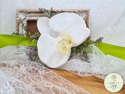 Vibrant White Orchid Wrist Corsage &amp; Boutonnière with lime green Satin Ribbon, perfect for Tropical Weddings. Handcrafted with Realistic Polyester, adorned with dried Statice &amp; Caspia, these eco-friendly pieces make lasting keepsakes.