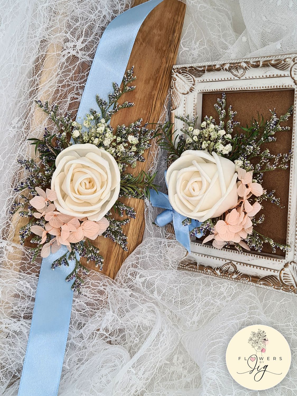 Crème Rose Wedding Corsage &amp; Boutonnière set made from eco-friendly sola wood roses, adorned with Peach Hydrangea, and blue satin ribbon. Perfect for brides and grooms. Customizable colors. Long-lasting keepsake. Sustainable wedding floral accessory.