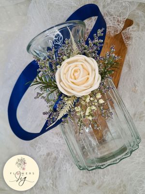 Handcrafted Crème Rose Sola Wood Corsage or Boutonnière with Gypsophilia, fern, and iris. Durable, eco-friendly, perfect for weddings or proms. Complements bridal gowns and grooms’ jackets with royal blue satin ribbon. Size: 4.5 inches