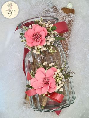Handcrafted pink sola wood cosmos boutonniere or corsage adorned with dried gypsophila and polymer greenery. Perfect for weddings or proms, this elegant floral accessory is made to order#Boutonniere #Corsage #FloralFashion