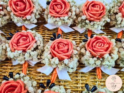 Elegant Tangerine Rose Boutonnière - Perfect for weddings and proms, featuring a sola wood tangerine rose, gypsophila, black beads, and a white ribbon. Handcrafted for timeless elegance and eco-friendly charm, enhancing any formal look