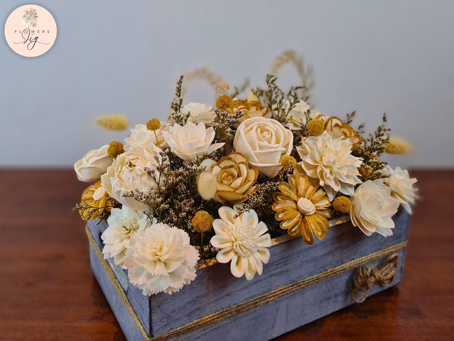 Experience rustic charm with our Country Roads Sola Wood Floral Box. Featuring hand-crafted flowers and dry meadow grass in a grey oak box, this piece is perfect for table decor, weddings, or as a thoughtful gift