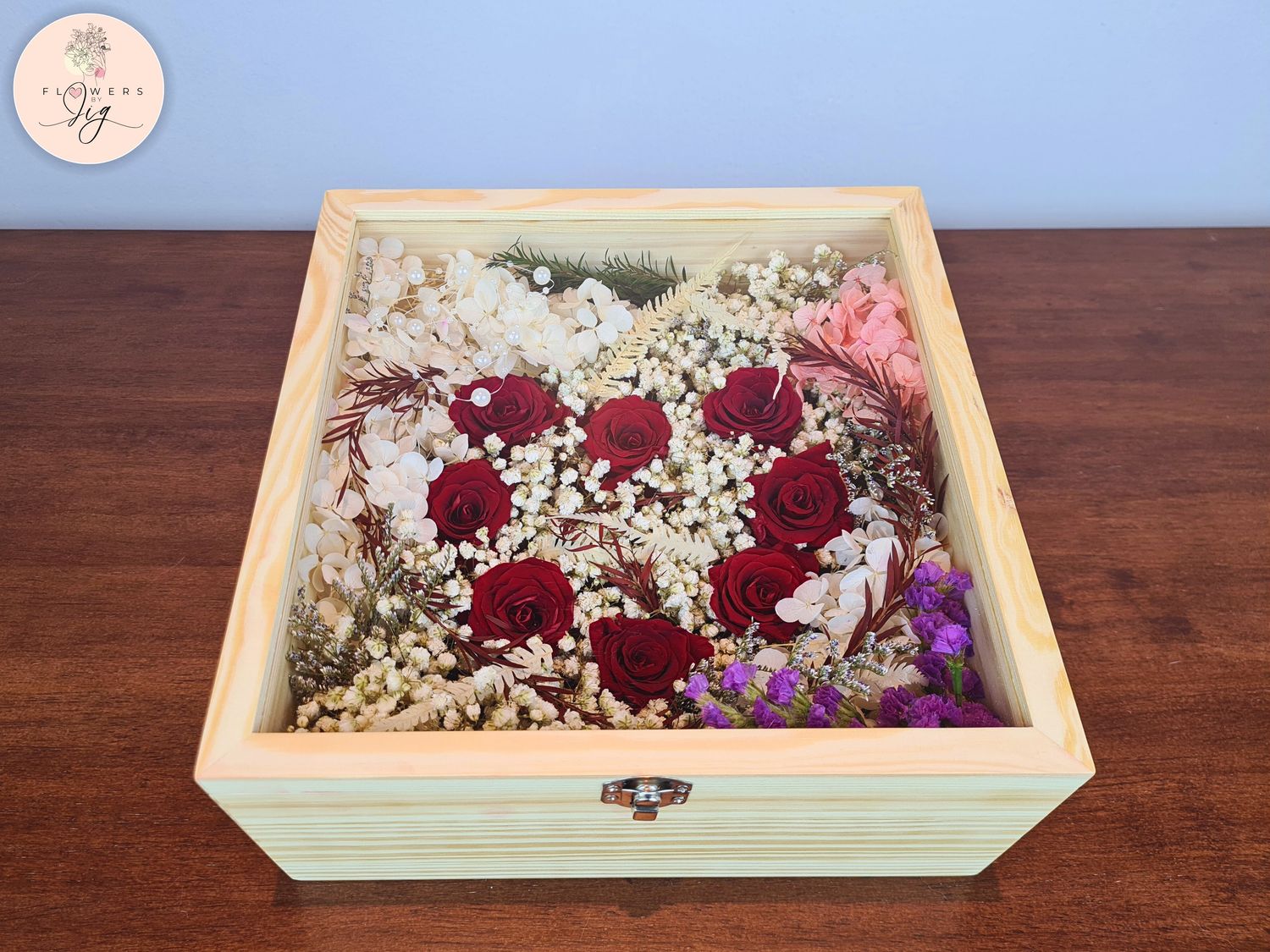 Pinewood box with 8 heart-shaped preserved red roses, hydrangea, ferns, gypsophila, statice, and caspia. Decorative beads and luxurious satin ribbon. Ideal for anniversaries, weddings, 