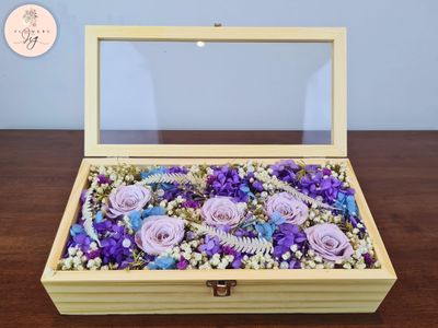 Elegant Pinewood Box with 5 Purple Infinity Roses, preserved for lasting beauty. Includes hydrangea, ferns, gypsophila, statice, caspia, and decorative beads. Perfect gift for anniversaries, weddings, or home decor. Sustainable and luxurious.