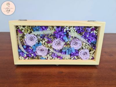 Sophisticated Glass Box Bouquet featuring 5 preserved Purple Roses and assorted dried flowers. Includes hydrangea, ferns, gypsophila, statice, caspia, and decorative beads. Perfect for special occasions, adding lasting elegance to any space