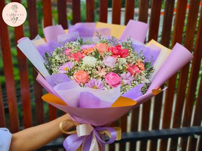 Charming Sola Wood Floral Gift: Our Blooming Bouquet, with sola wood roses, daisies, &amp; jasmine, wrapped in colorful ribbons, is perfect for weddings | special occasions. Pastel hues and handcrafted detail ensure a vibrant, long-lasting floral display