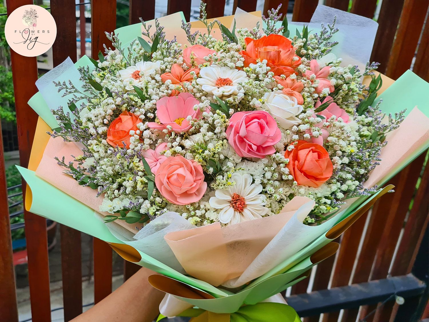 Handcrafted sola wood flower bouquet featuring roses, jasmine, daisies, and peonies, wrapped in colorful floral paper and satin ribbons. A long-lasting, elegant choice for weddings, anniversaries, bridal showers, and other special occasions.