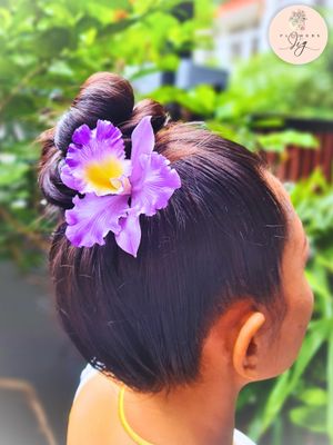 Realistic Purple Cattleya Orchid Hair Pin, hand-crafted from flexible polymer clay. Features a lifelike floral design in purple, white, and yellow, perfect for adding elegance to bridal or evening wear