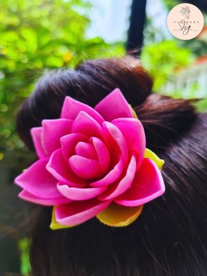 Handmade Pink Magnolia Hair Pin in vibrant pink polymer clay. Realistic floral design with flexible and durable construction, perfect for weddings, parties, and photo shoots