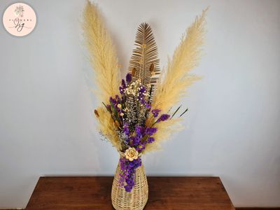 Hand-woven rattan vase with dried flowers: caspia, purple statice, pampas, cycad leaves, and handmade Sola wood rose. DIY set-up. Treated with Glycin for long-lasting beauty, perfect for home decor with a romantic, wild touch