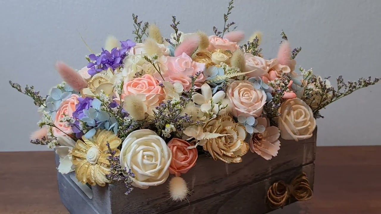 A beautifully arranged Artificial Flower Box featuring a mix of multi-colored faux roses