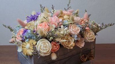 A beautifully arranged Artificial Flower Box featuring a mix of multi-colored faux roses
