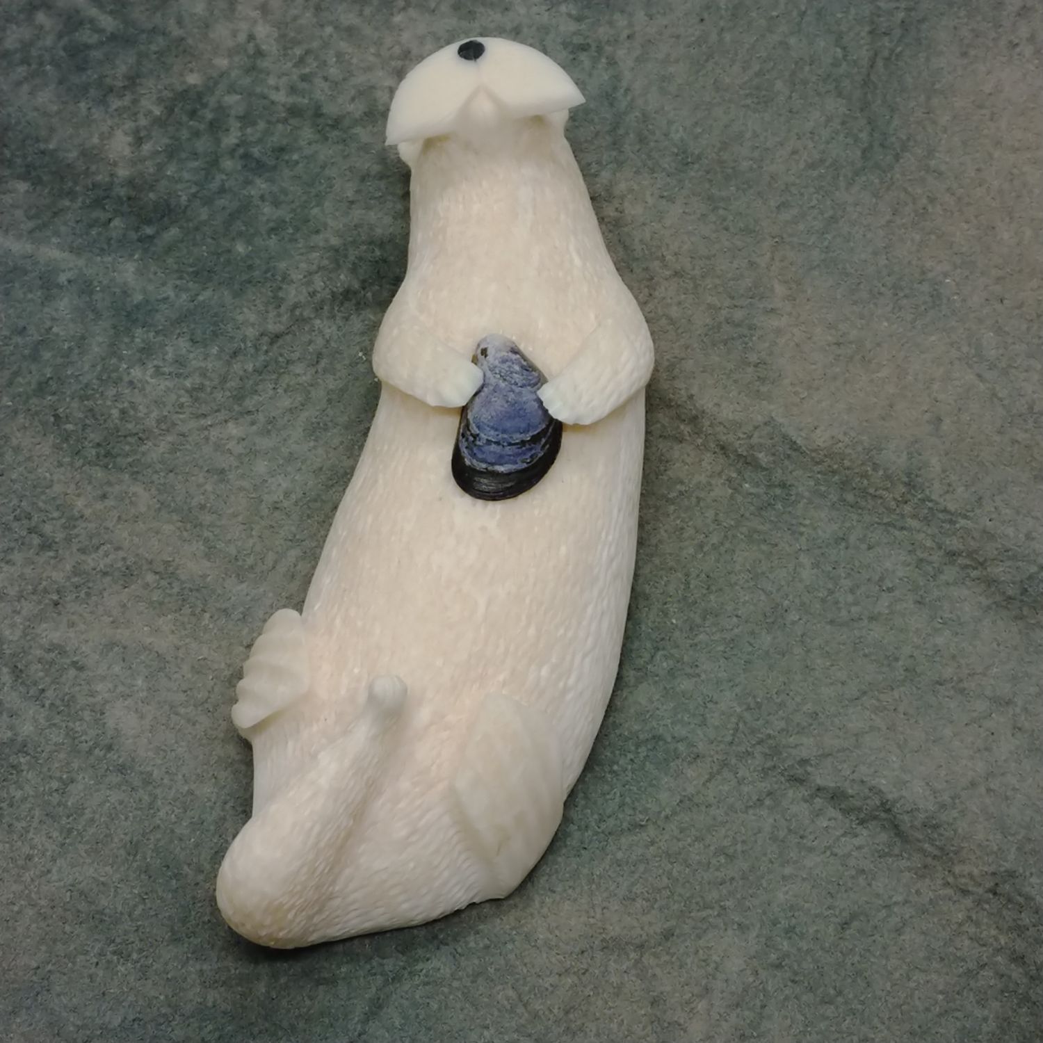 Floating Sea Otter with Mussel