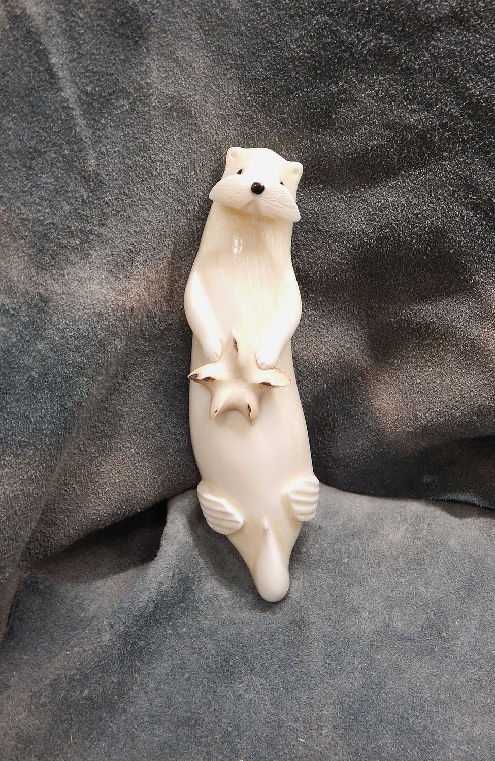 Floating Sea Otter with Sea Star