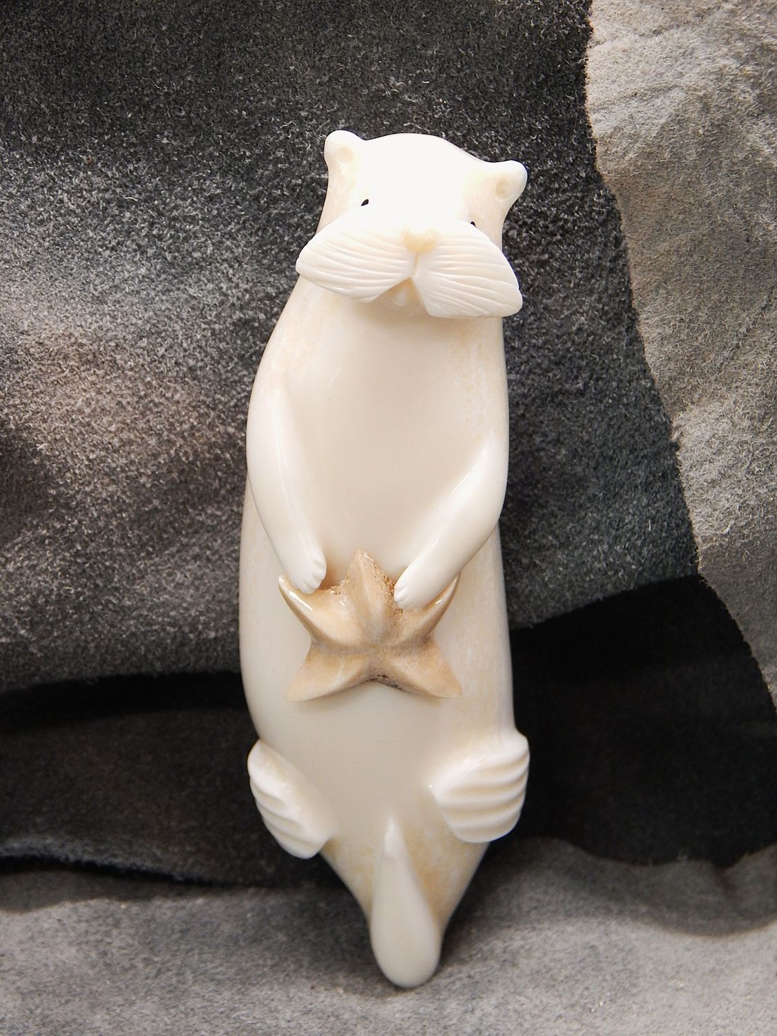 Floating Sea Otter With Sea Star