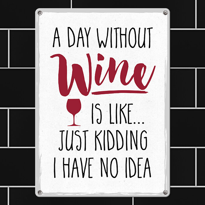 Металлическая табличка A day without wine is like…