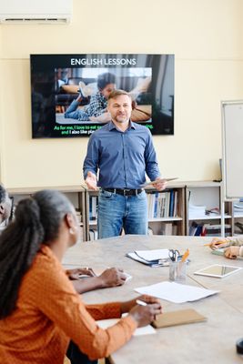 Instructor standing at front of room