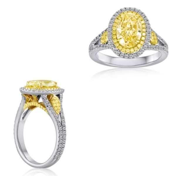18k White and Yellow Gold .82ct Yellow Diamond Oval Halo Ring. 1.7ctw