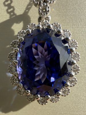14k White Gold 7.31ct Tanzanite Pendant accented with 0.32ctw Diamonds on 18" Adjustable Chain