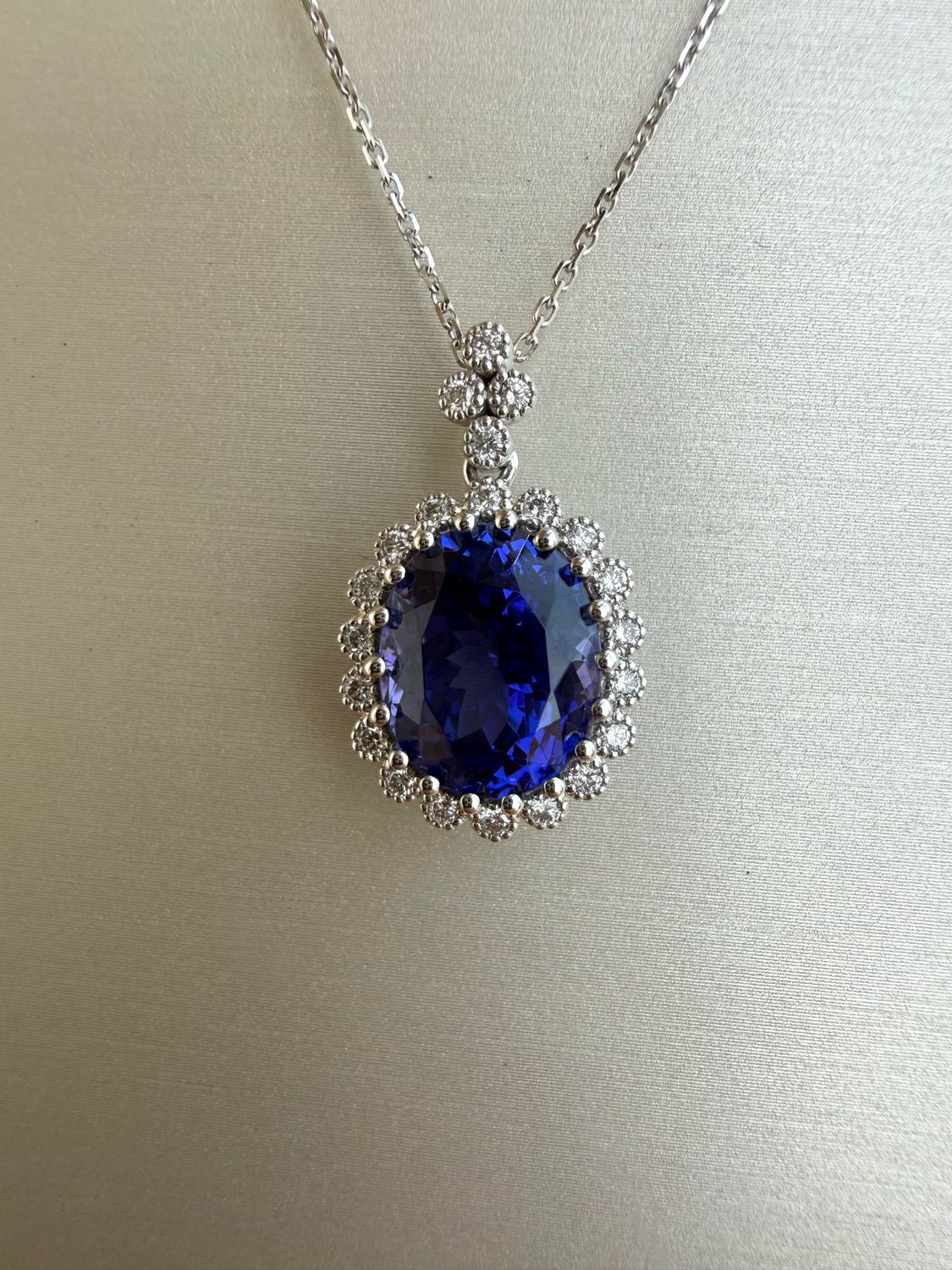 14k White Gold 7.31ct Tanzanite Pendant accented with 0.32ctw Diamonds on 18" Adjustable Chain