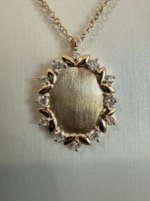 14k Yellow Gold Oval Floral and Diamond Necklace with Sandblast Finish .29ctw Diamonds