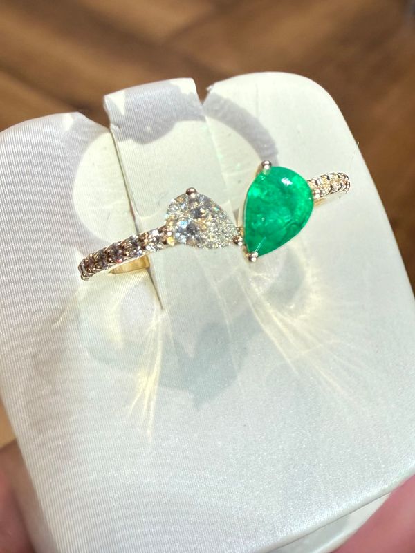14k Yellow Gold Ring with Pear Shape Emerald and Pear Shape Diamond with Diamond accents.  Em:.30ct  Dia: .31ctw