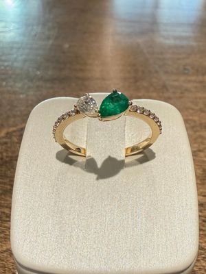 14k Yellow Gold Ring with Pear Shape Emerald and Pear Shape Diamond with Diamond accents.  Em:.30ct  Dia: .31ctw
